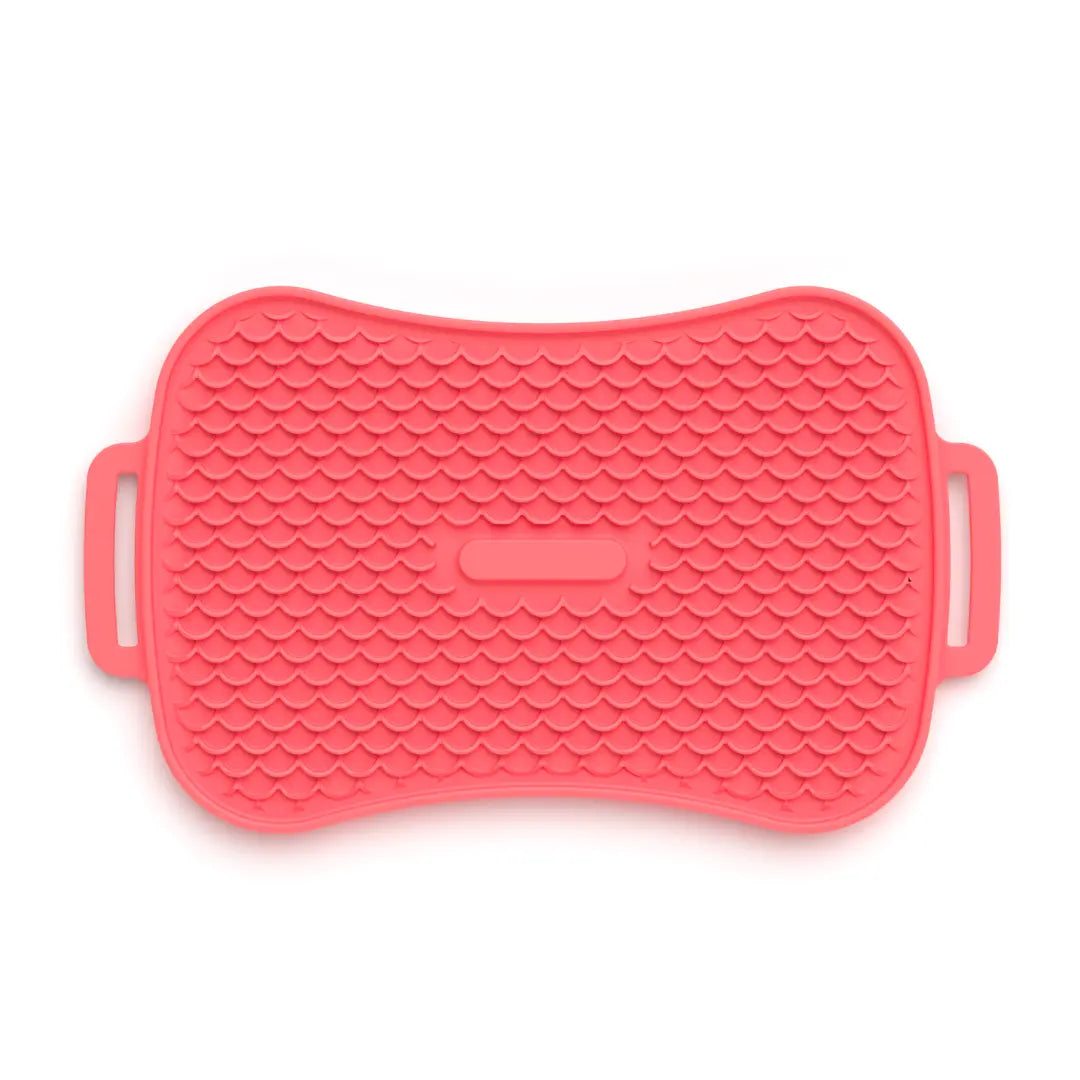 Coral silicone lick mat for slow feeder dog bowl, front textured view with handles