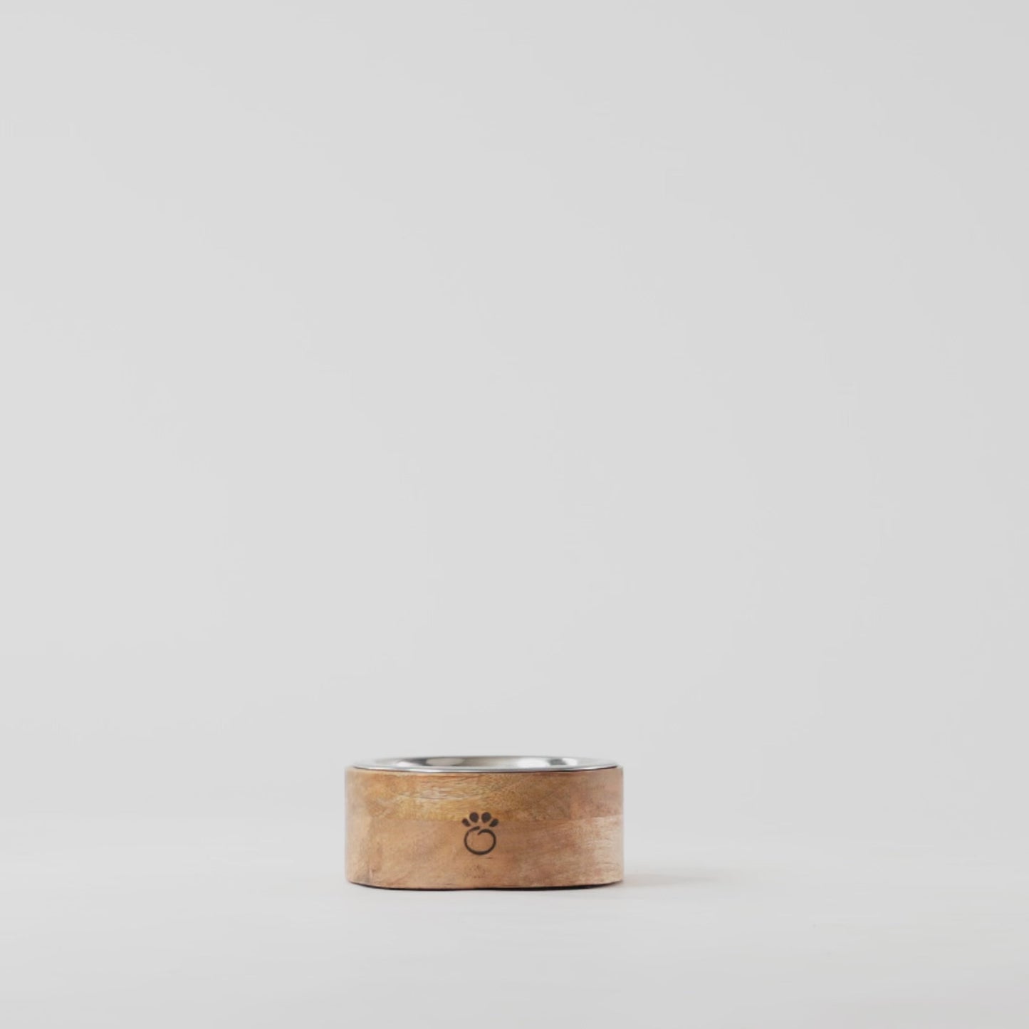 Side profile of GF Pet handcrafted mango wood single pet bowl with stainless steel insert on white background