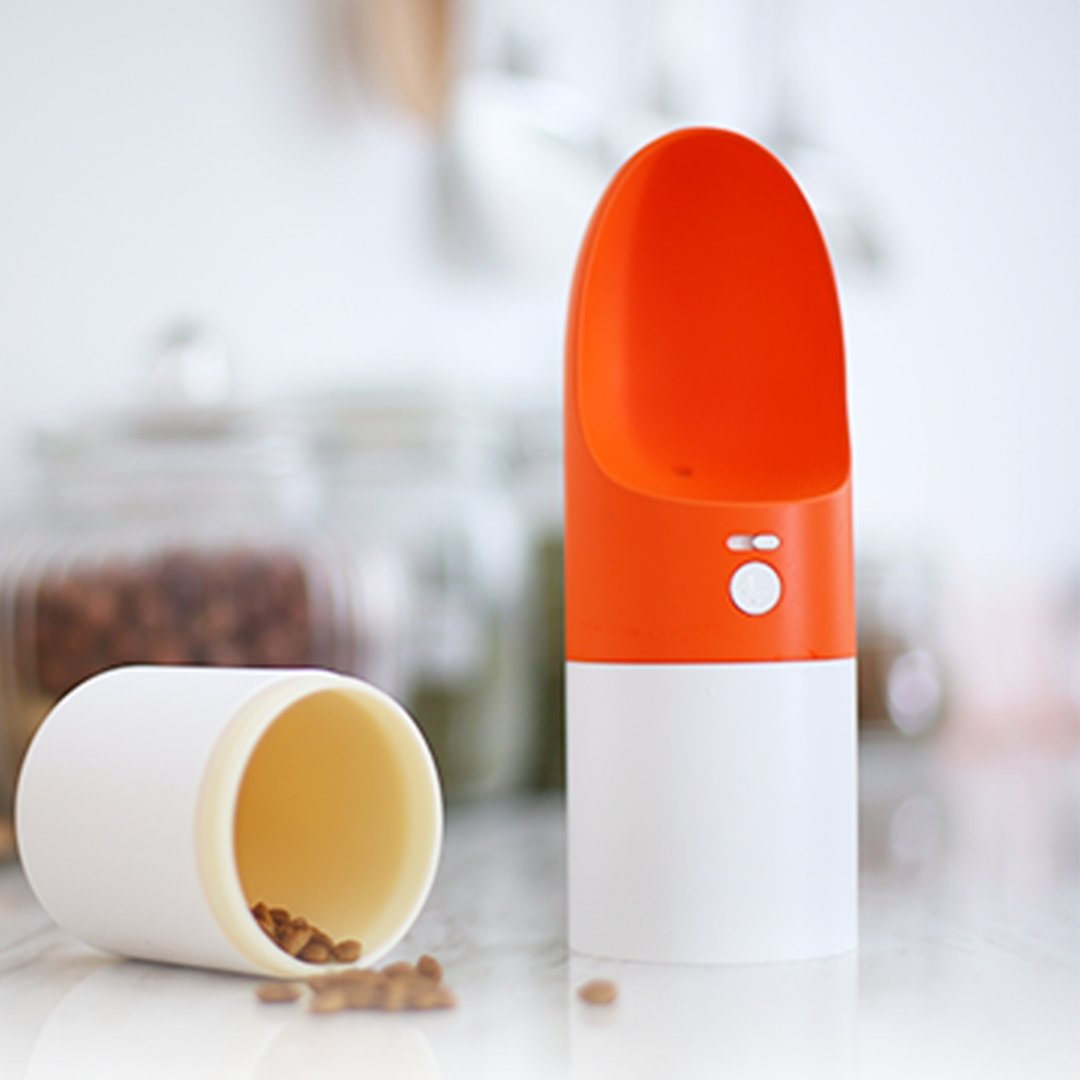 INSTACHEW Rover orange and white pet water feeder attachment with bowl component on blurred background