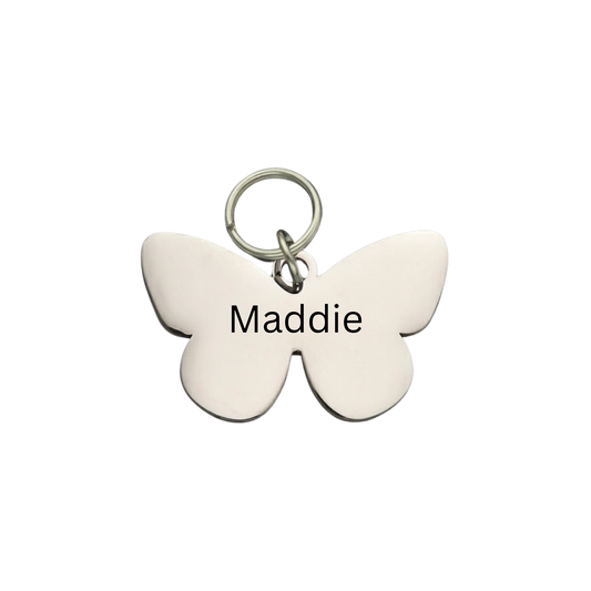 Custom butterfly pet ID tag in polished silver with engraved dog name Maddie