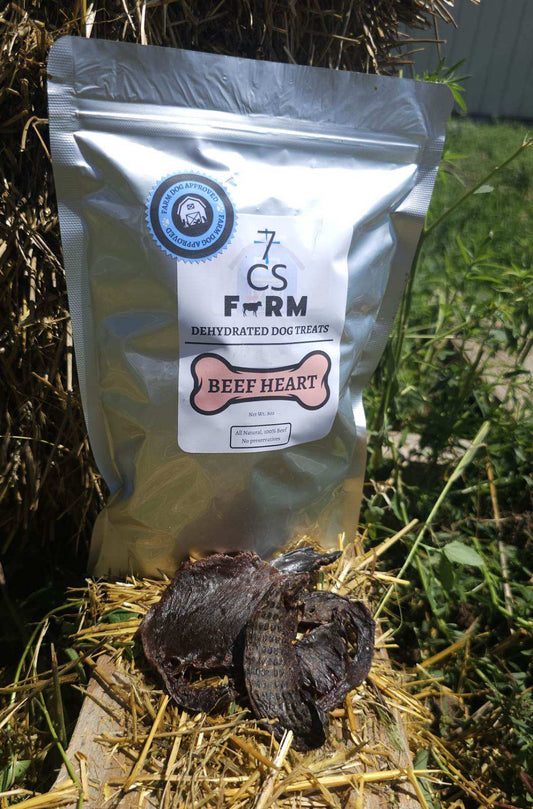 7CS Farm dehydrated beef heart dog treats bag with single-ingredient beef heart treats displayed on natural hay background